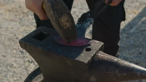 Blacksmith forges an ax Stock Footage 170183832