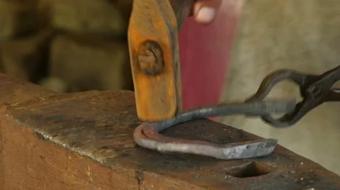 Blacksmith forges a horseshoe, 4k 5 Stock-Footage 49689130