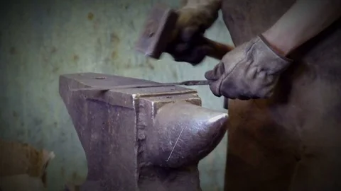 Blacksmith forges iron on anvil. Stock Footage 73446259