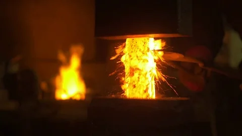 Blacksmith forges iron Stock Footage 72693043