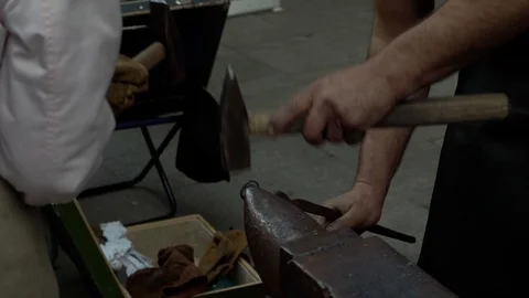 A blacksmith forges an iron ring, craft Video stock 118548205