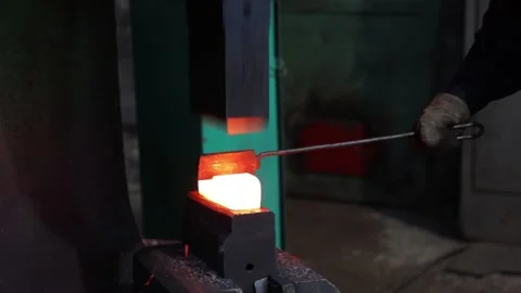Blacksmith forges metal Stock Footage 171632977