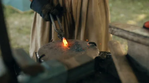 Blacksmith Forges Metal. Slow-mo Stock Footage 68054565