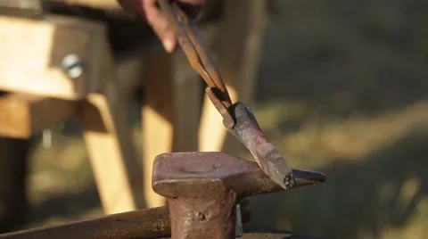 Blacksmith forges a spear on the anvil Stock Footage 56161375