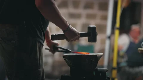 Blacksmith Forging Handmade Knife with Hammer in Workshop Stock Footage 339751498
