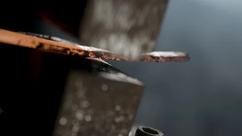 Blacksmith forging a hot iron bar 動画素材 92058479