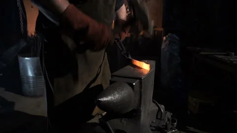 Blacksmith forging hot metal on a close-up Stock-Footage 91416026
