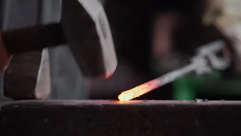 Blacksmith forging hot metal Stock Footage 245263158