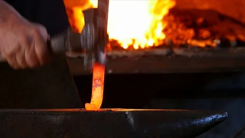 Blacksmith Forging Iron on an Anvil Stock Footage 81547440