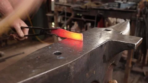 Blacksmith forging iron hammer and anvil Stock Footage 160301853