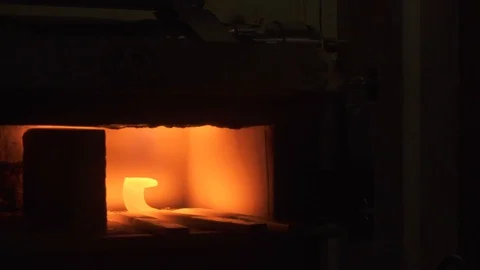Blacksmith forging iron in his workshop Stock Footage 128596840