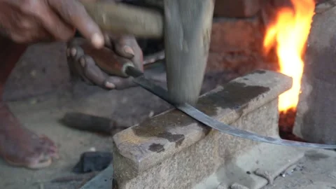 Blacksmith forging knife Stock Footage 342814736