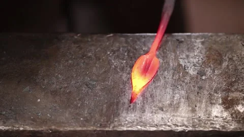 Blacksmith forging a leaf at the anvil Stock Footage 133954578