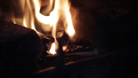 Blacksmith forging the molten metal on the anvil in smithy Video stock 70825832