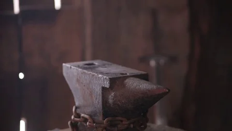 Blacksmith forging the molten metal on the anvil in smithy 動画素材 70825839