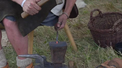 Blacksmith Forging a Nail Stock Footage 302028470
