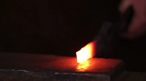 Blacksmith forging red hot iron, sparks fly, slow motion, slider, closeup Stock Footage 39018060