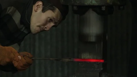Blacksmith forging red hot iron on anvil, forging hot metal in smithy Stock Footage 72219239