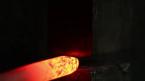 Blacksmith forging red hot iron on anvil, Forging hot metal in smithy Stock Footage 72219600
