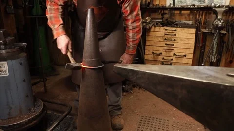 Blacksmith forging ring on cone mandrel Stock Footage 153798966