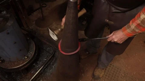Blacksmith forging ring on cone mandrel Stock Footage 153798980