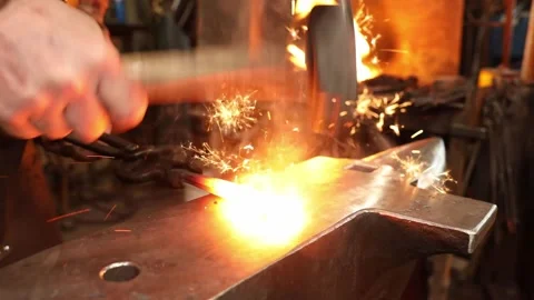 Blacksmith forging welding on the anvil Stock Footage 153798971