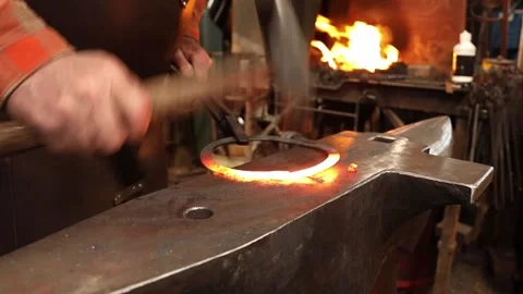 Blacksmith forging welding ring on anvil Stock Footage 153798979