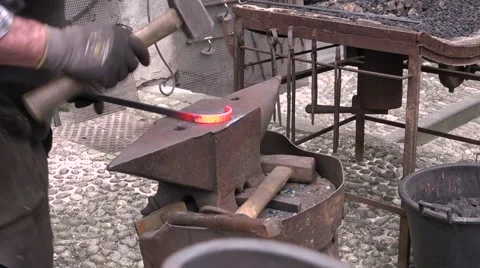 Blacksmith forging wrought iron anvil hammer Stock Footage 63472358