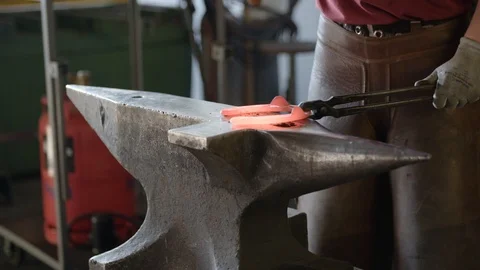 Blacksmith forming a horseshoe Stock Footage 101959659