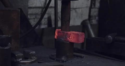 Blacksmith forms Axe Handle Hole and breaks it loose 스톡 동영상 152256392