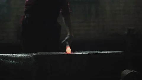Blacksmith girl working in her workshop Stock Footage 155349524