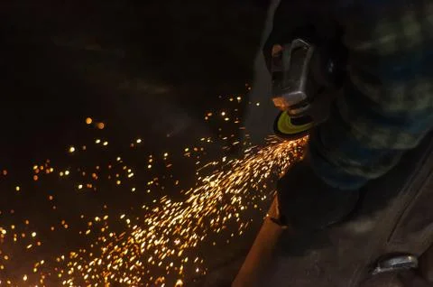 Blacksmith grinding the metal Stock Photos