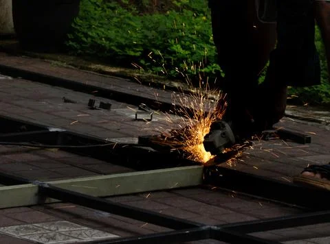 Blacksmith on grinding works Stock Photos