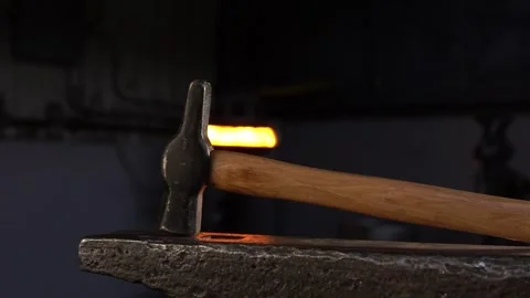 Blacksmith Hammer on Anvil in a Forge with Lateral Movement Stock Footage 255408771