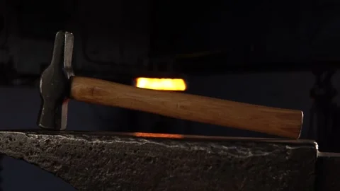 Blacksmith Hammer on Anvil in a Forge with Vertical Movement Stock Footage 255408741