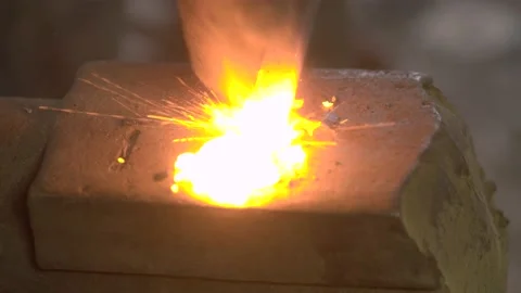 Blacksmith Hammer Forging a Blade from White Hot Metal Stock Footage 139581125