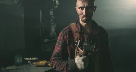 Blacksmith with a hammer in his hand Video stock 165646912