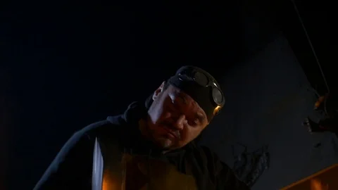 Blacksmith with hammer works Stock Footage 69858901