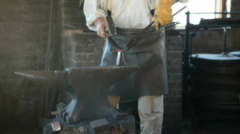 Blacksmith hammering an anvil HD Stock-Footage 474390