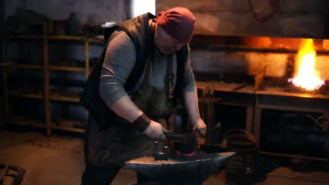 Blacksmith is hammering the horseshoe Stock Footage 101052669