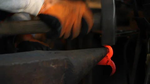 Blacksmith hammering hot iron Stock Footage 33735663
