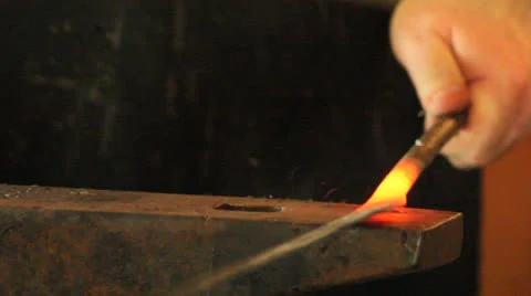 Blacksmith hammering hot metal Video stock 25842043