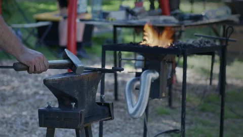 Blacksmith Hammering Metal Beside Forge Fire Stock Footage 340320756