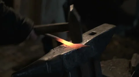 Blacksmith hammering metal Stock Footage 47852972