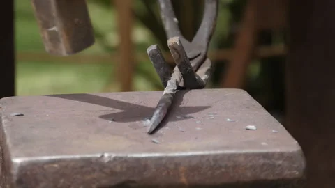 Blacksmith hammering metal at medieval forge slow motion Stock Footage 138406341