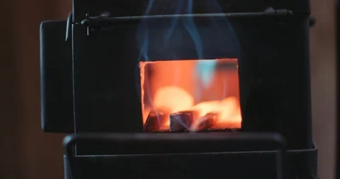 Blacksmith heating iron nails in a red hot forge Video stock 105295634
