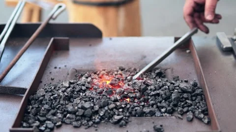 The blacksmith heats metal Stock Footage 258619812