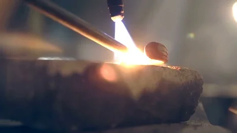 Blacksmith heats parts for forging. Close-up Stock Footage 76399793