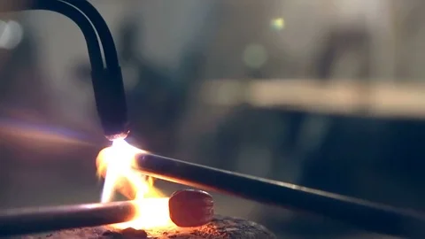 Blacksmith heats parts for forging. Close-up 스톡 동영상 77028167