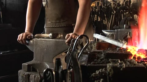 Blacksmith heats a stem in fire, he is preparing for forging. Stock Footage 49401575